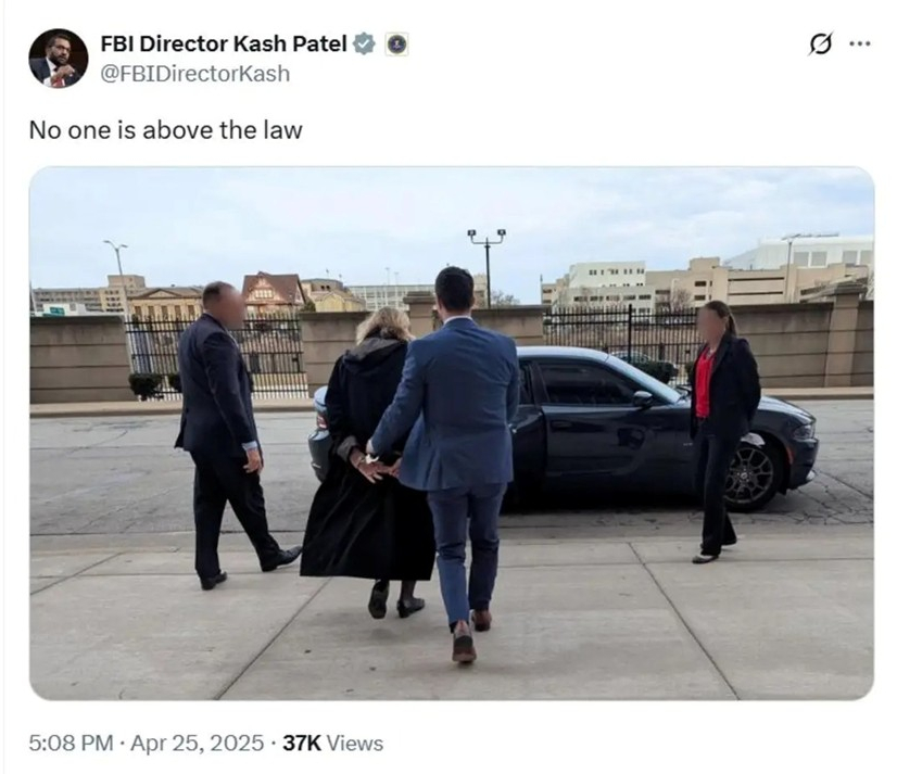 Picture of Judge Dugan being arrested and hauled off to jail.
